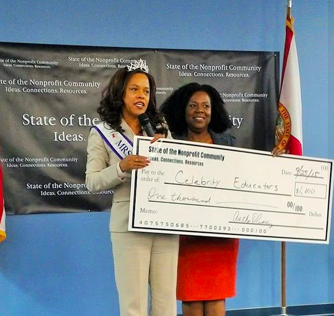 Award presentation at the State of the Nonprofit Community summit — check presented to Celebrity Educators